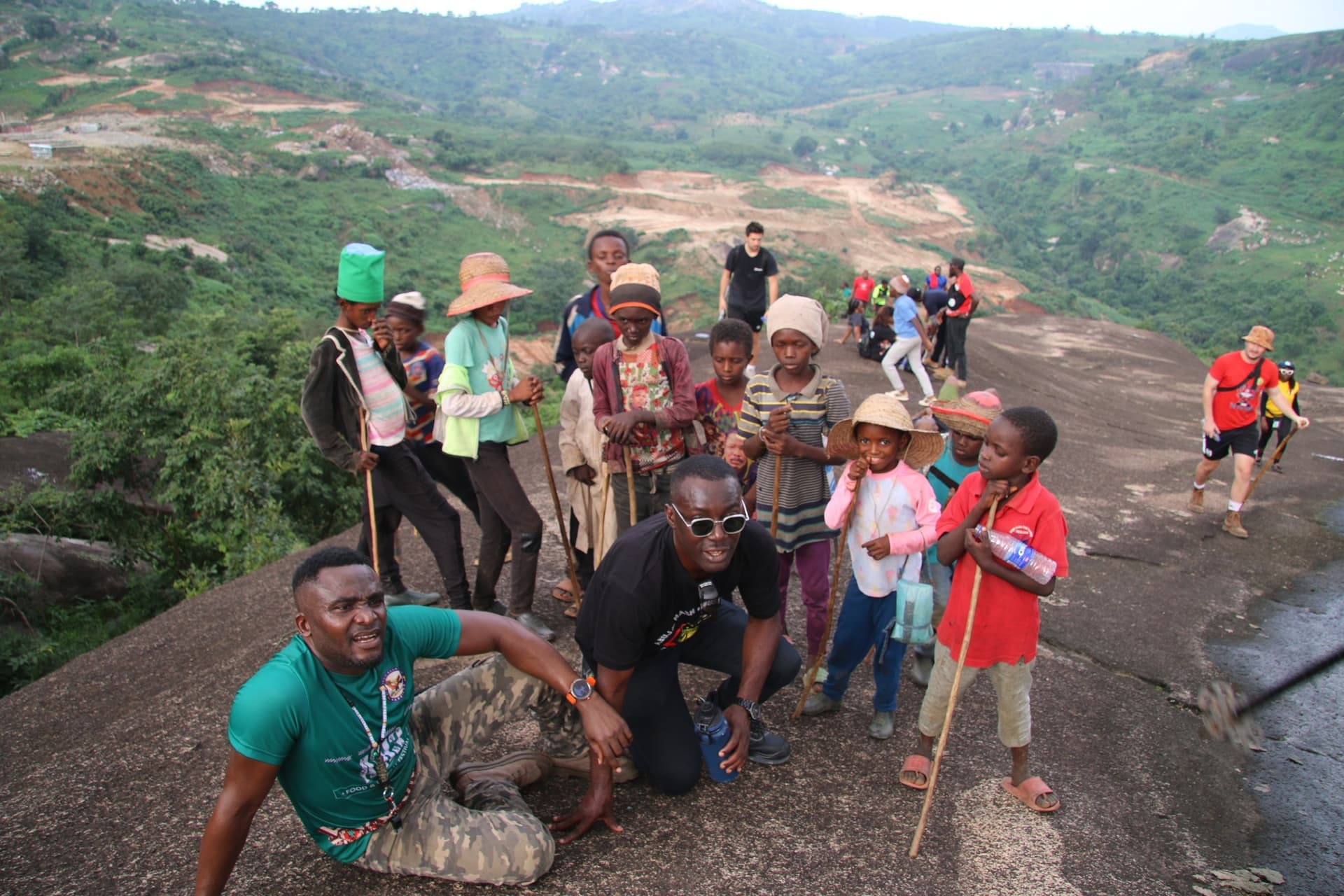 The pack with local children on the trail